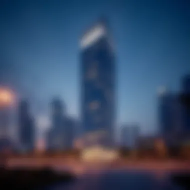 An evening view of the Single Business Tower illuminated against the Dubai skyline.